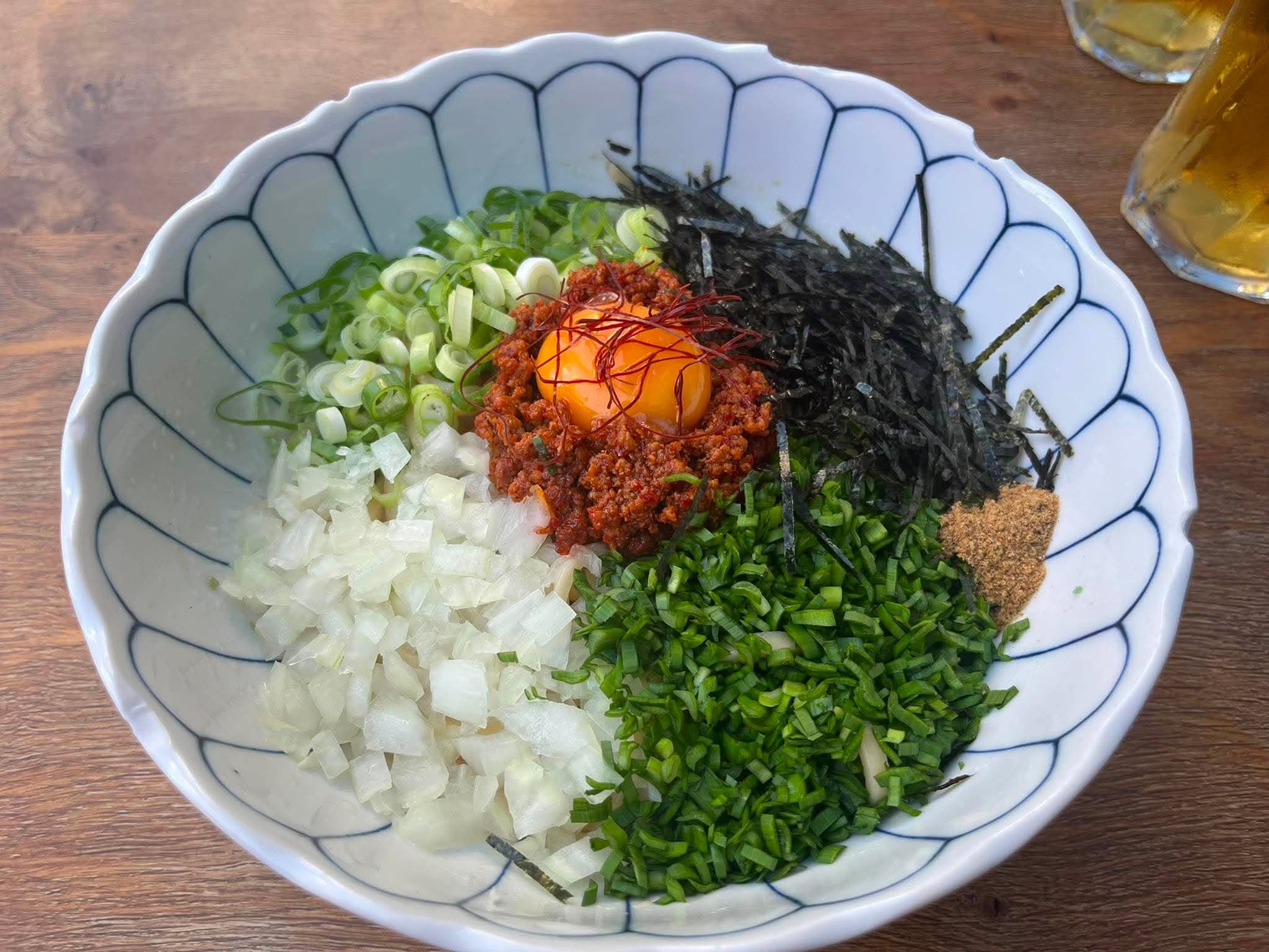 Mazesoba soup-less ramen at Tenmaru Finsbury Park — miso pork mince, egg yolk, chive, onion and nori